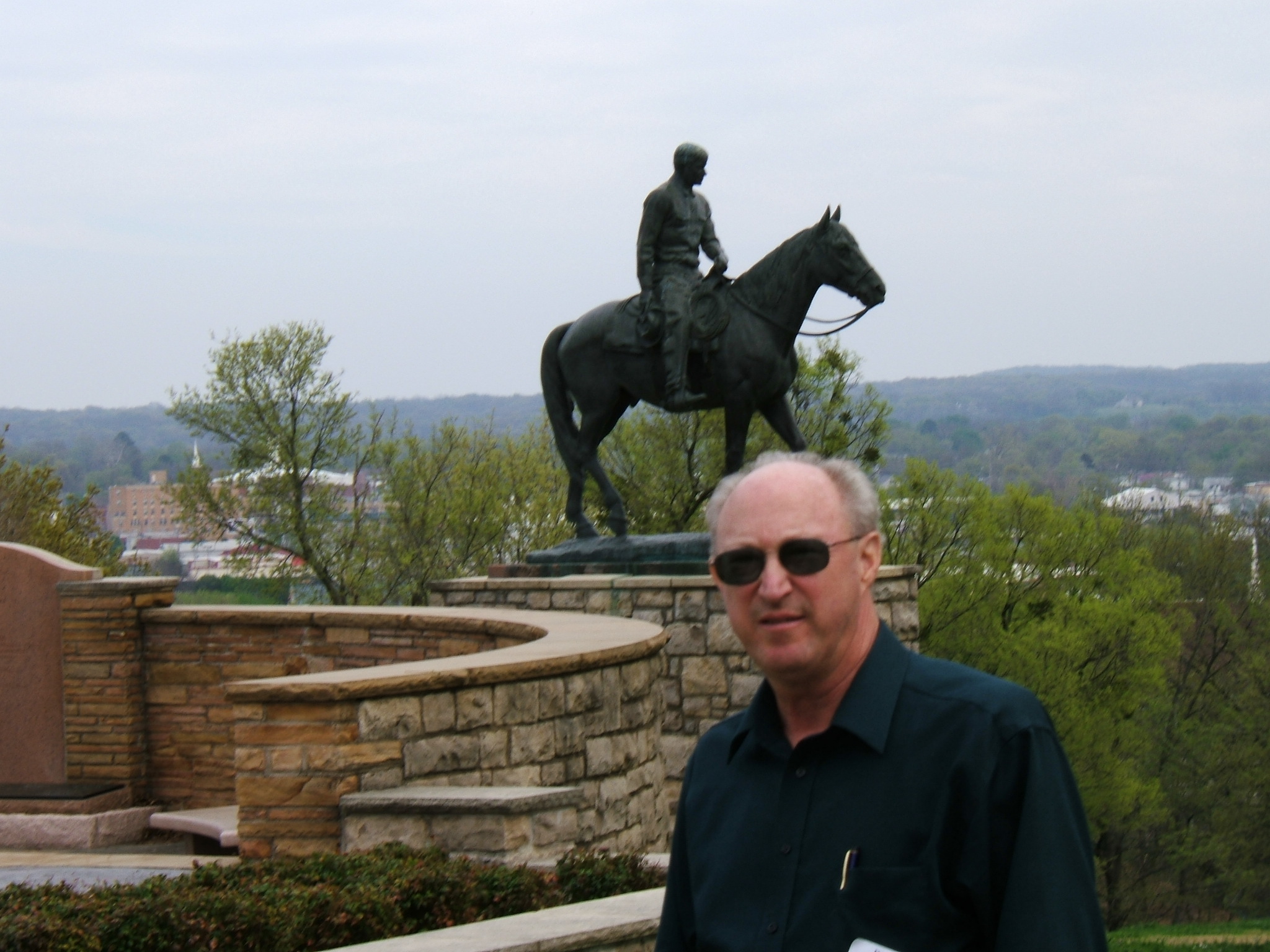 Don in front of Will Rogers statue on horse